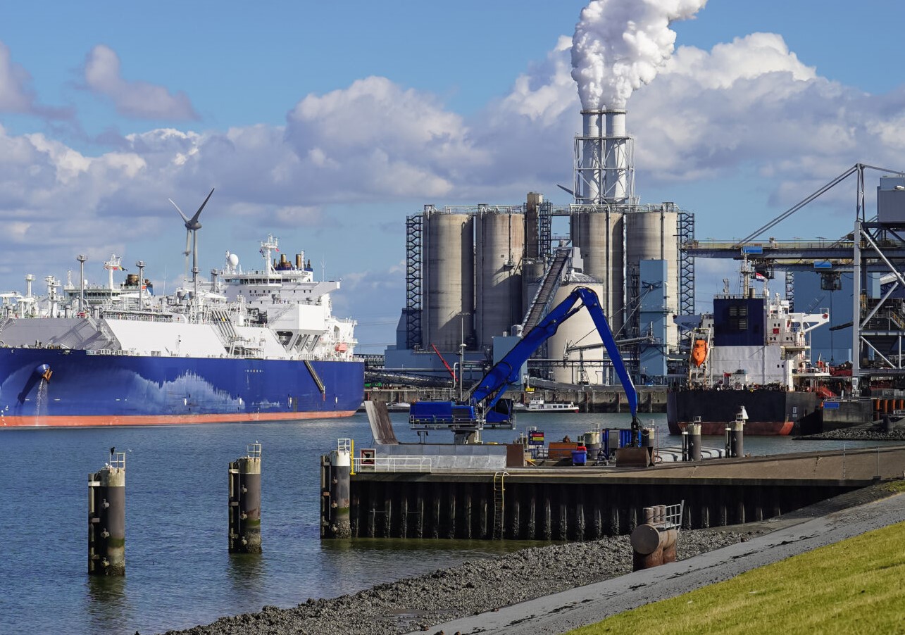 The brand new floating LNG terminal in the Eemshaven, beside a coal-fired power station (RWE).